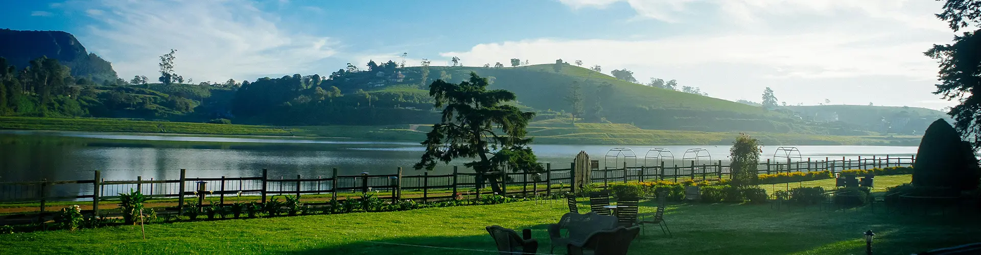 A peaceful lakeside garden with views of the rolling tea estates, a relaxing hill country retreat arranged by Universal Ceylon Travels