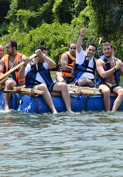 Friends enjoying a fun outdoor rafting experience together on a tropical river, highlighting the diverse group activities available on our MICE Sri Lanka tours