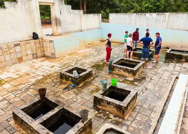 Travelers visiting the famous hot water wells during a private Sri Lanka tour