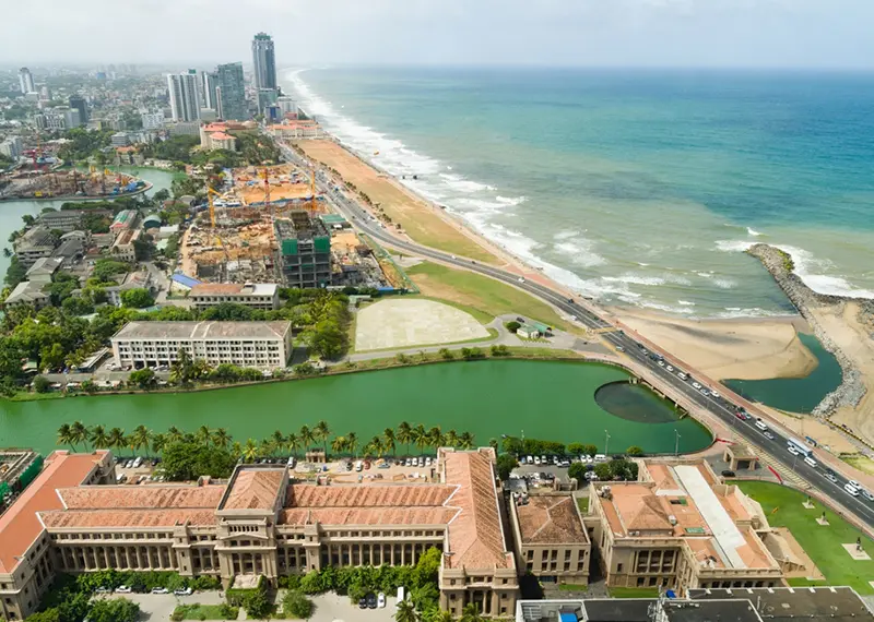 Aerial view of Colombo city featuring Beira Lake and the Indian Ocean