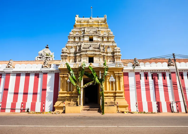Traditional Hindu temple with red and white striped walls in Sri Lanka