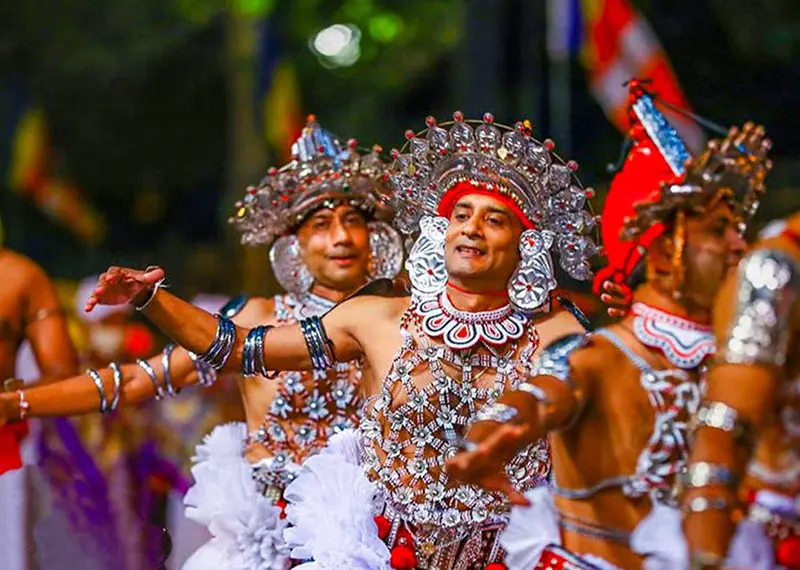 Traditional Kandyan dancers perform in elaborate costumes during a Sri Lankan festival