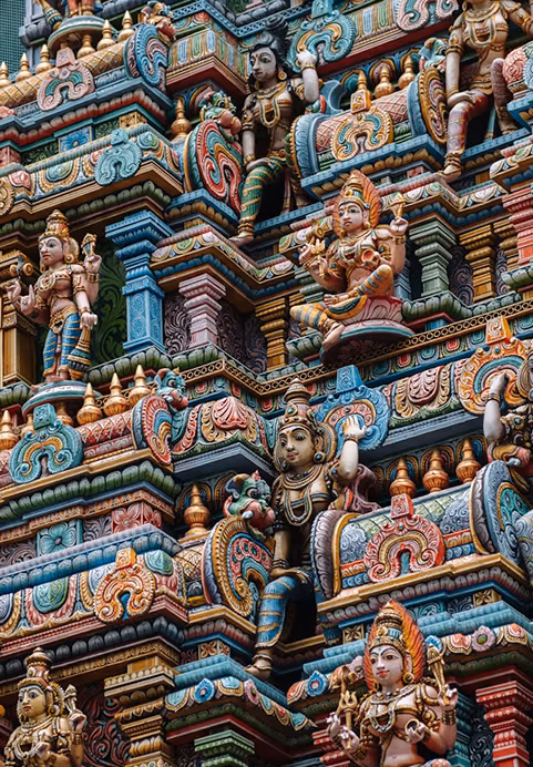 A detailed view of colorful, ornate Hindu temple carvings showcasing exquisite traditional craftsmanship, a cultural highlight featured in our Sri Lanka Ramayana Tour packages