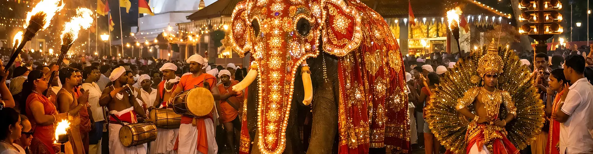 A brightly illuminated elephant parading with traditional drummers and fire dancers at night, showcasing the vibrant cultural festivals included in our Sri Lanka The Silk Road & Southern Sands package.