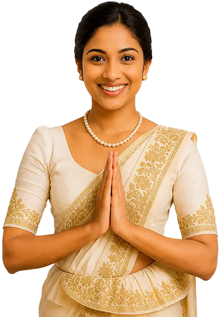 A smiling Sri Lankan woman in a traditional Kandyan sari offering a warm Ayubowan greeting with pressed hands, welcoming you to book our Sri Lanka tour packages